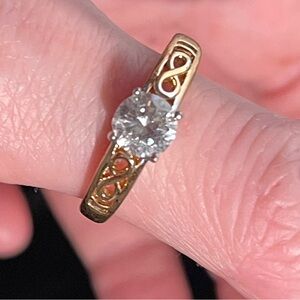 CZ solitaire ring with intricate setting